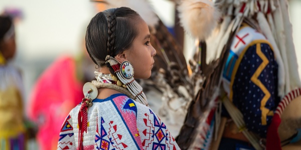 a young woman in regalia at Red Bottom Celebration