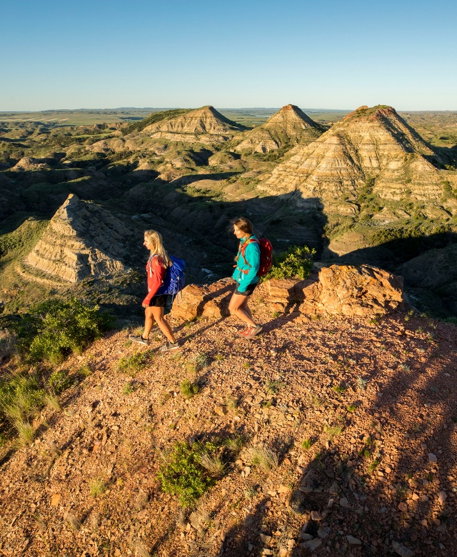Two people hiking the Terry Badlands