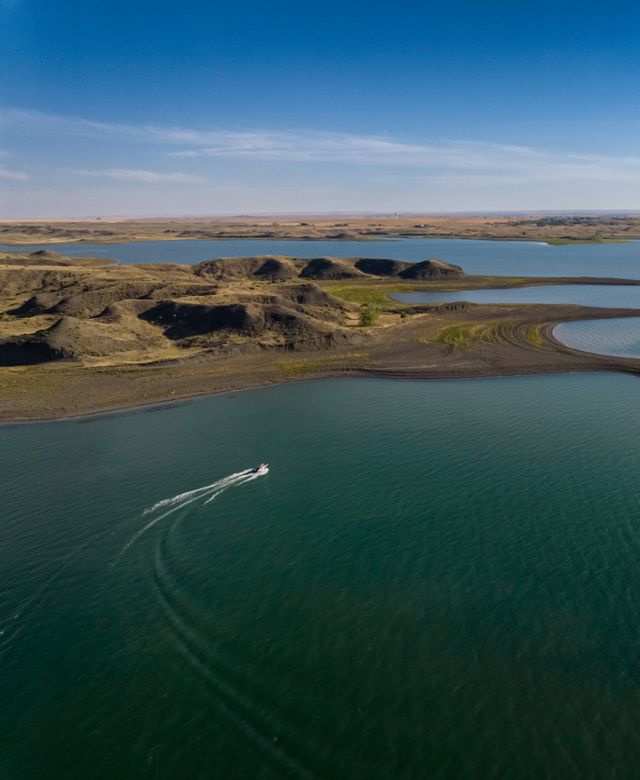 An aerial view of the shoreline of Fort Peck Reservoir