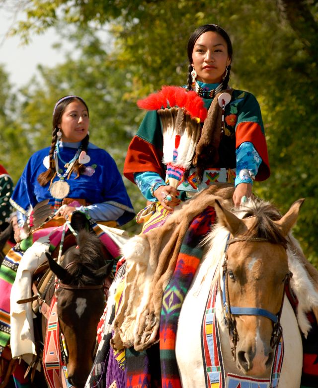 Native women riding horses