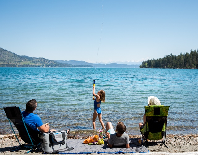 family playing on a beach