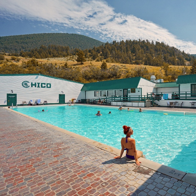 woman sitting pool side at Chico Hot Springs