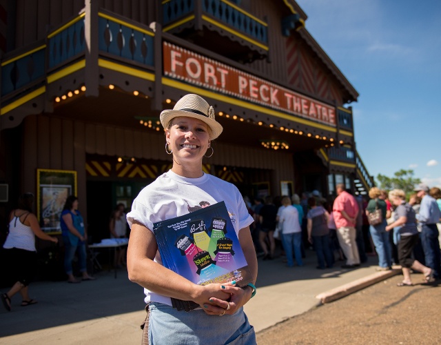 woman standing in front of Fort Peck Theater