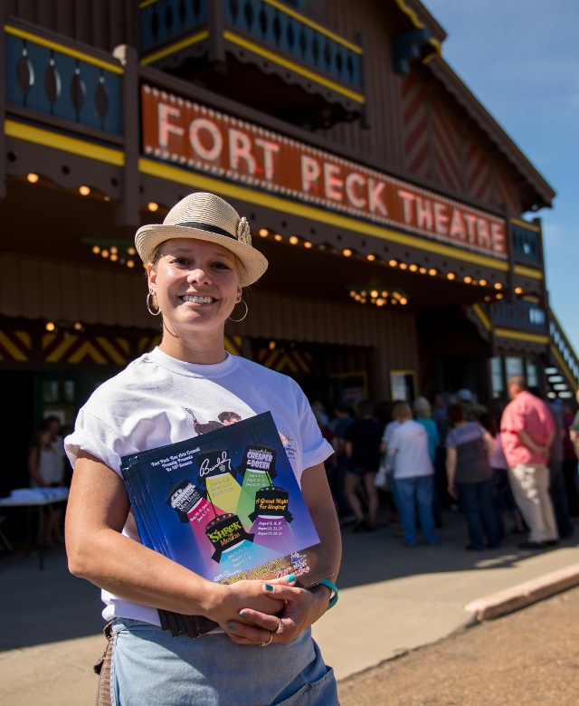 woman standing in front of Fort Peck Theater