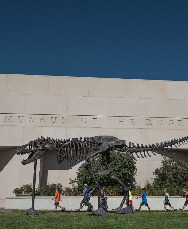 dinosaur sculpture outside of museum