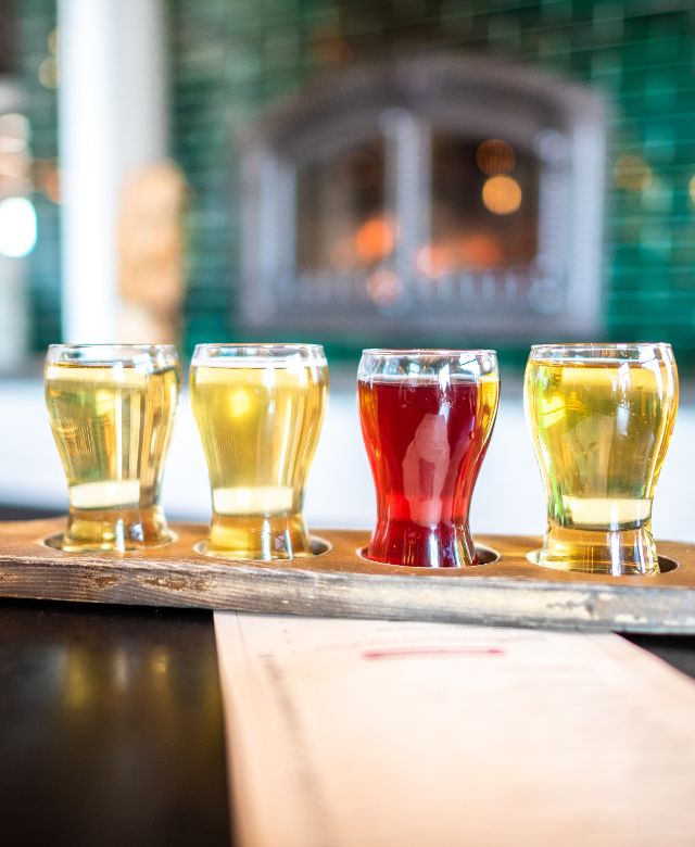 A flight of four glasses of sample mead