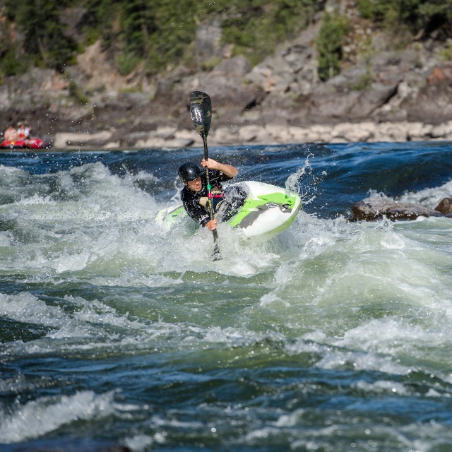 people whitewater kayaking