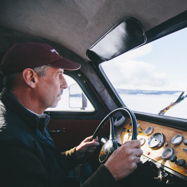 man driving snowcoach