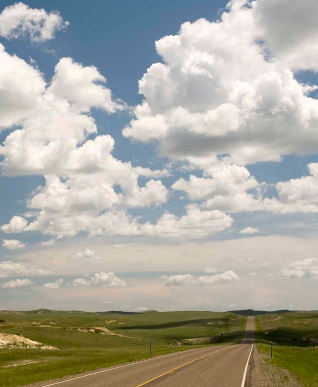 Cloud filled blue sky from Highway 253 near Circle.jpg