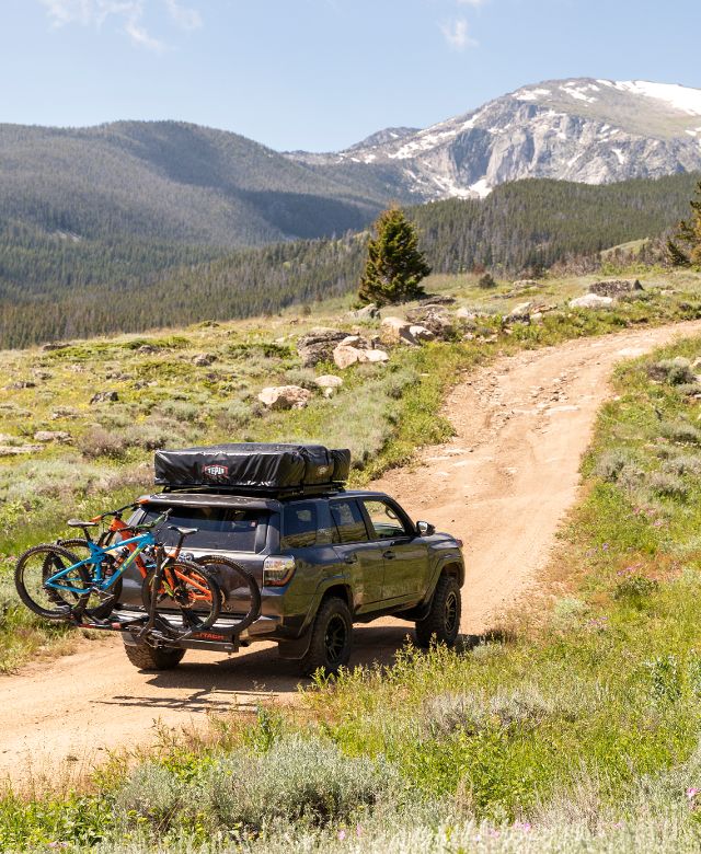 car driving along dirt road