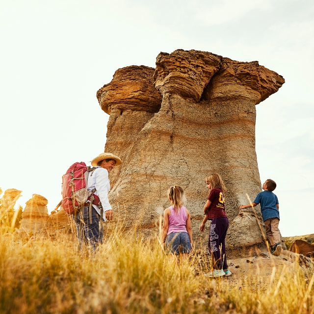 A family of four hiking at Makoshika badlands