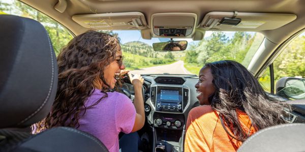Two girls driving through Montana