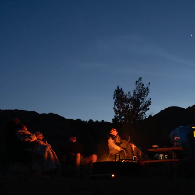 Family camping under the stars in Makoshika