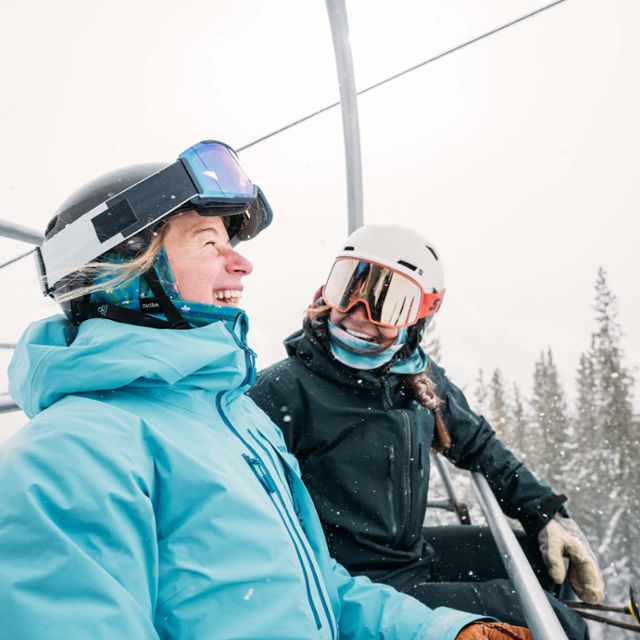 Friends laughing on lift
