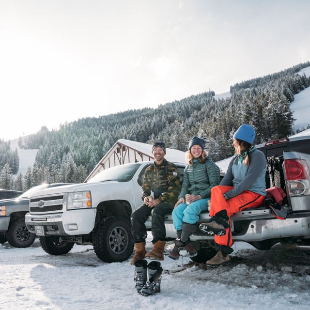 Friends tailgaiting in ski gear